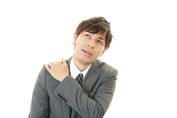 肩痛を訴えるビジネスマン