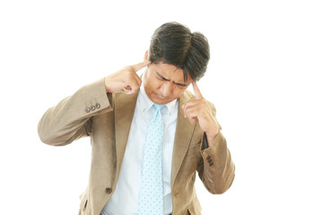 頭痛を訴えるビジネスマン