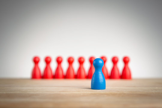 Stand out and be unique - leadership business concept with pawns