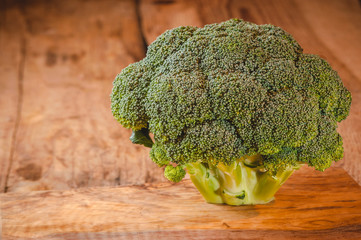 Green delicious broccoli on a wooden rustic table