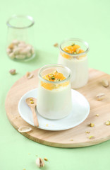 Pistachio Panna Cotta with Honey Orange Sauce
