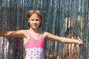 Portrait of a beautiful girl with metal chain