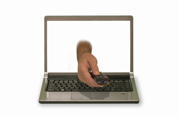 hand with remote control reaching out of laptop display