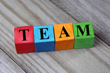 concept of team word on wooden colorful cubes