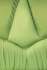Backgrounds of green leather sofa with stitch texture