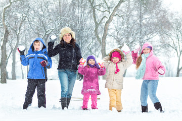 Happy family enjoying in winter