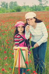 Vintage family on the poppy meadow