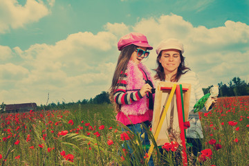 Vintage family on the poppy meadow