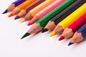 Fototapeta premium Many different colored pencils on white background