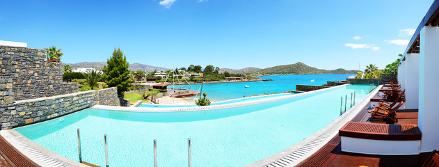 Panorama of swimming pool at luxury hotel, Crete, Greece