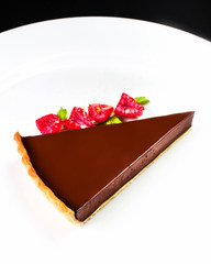 Chocolate dessert with raspberry. Chocolate cheesecake with rasp