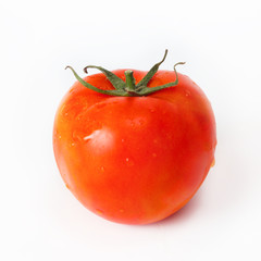 One organic fresh red tomato isolated on white