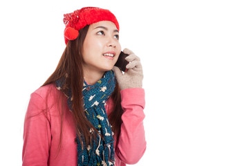 Asian girl with christmas hat look up talk on mobile phone