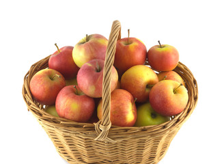 Ripe apples in wicker basket isolated
