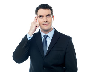 Confident Businessman point finger to head