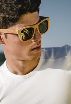 Model man portrait with wooden sunglasses