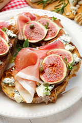 Grilled country bread with ham, blue cheese,  fig and capers