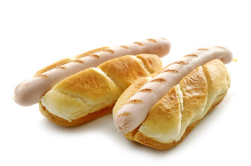 two bread buns with grilled sausages
