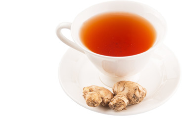 Ginger root and a cup of tea over white background