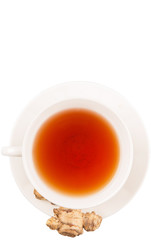 Ginger root and a cup of tea over white background