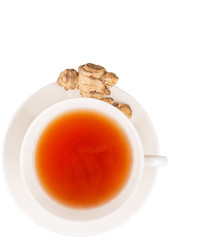 Ginger root and a cup of tea over white background