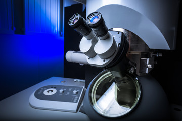 Modern microscope in a lab (color toned image; shallow DOF)