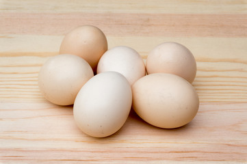 natural organic eggs on wood