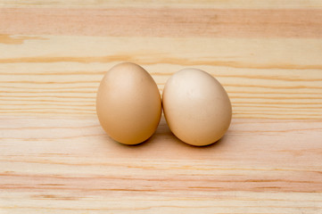 natural organic eggs on wood
