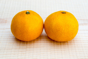 Oranges on wooden base