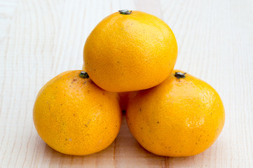 Oranges on wooden base