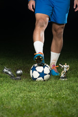 Legs Of Player With Ball And Coup