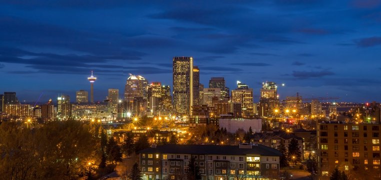 Calgary Skyline In The Early Morning With Rays From Rising Sun