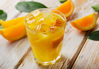 Orange juice on   wooden background