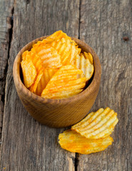 potato chips in a wooden bowl