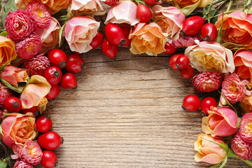 Roses on wooden background