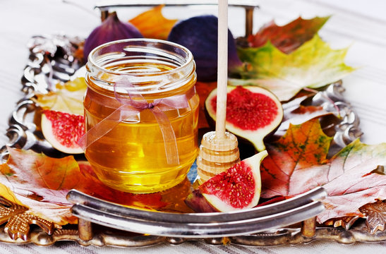 honey in jar and ripe fig
