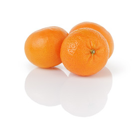 three ripe tangerines