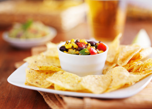tortilla chips and beer with fire roasted mexican corn black bean salsa