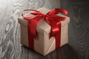 rustic gift box with red ribbon bow