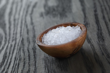 sea salt in wooden bowl for cooking or spa