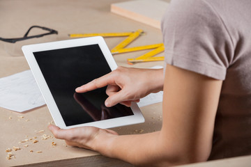 Female Architect Touching Digital Tablet's Screen