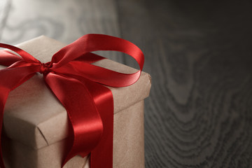 rustic gift box with red ribbon bow