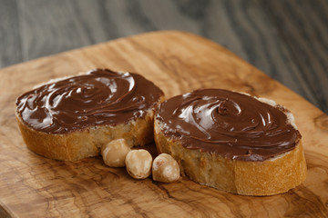 two baguette slices with chocolate hazelnut spread