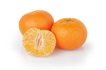 three ripe tangerines