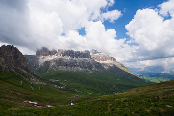 Fototapeta premium Sass Pordoi mount in blue sky with clouds, Dolomites