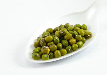 Mung Bean bean on white spoons