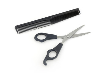 scissors and comb isolated on white