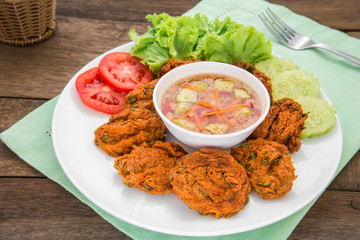 Fried fish cake and vegetables on plate, Thai food