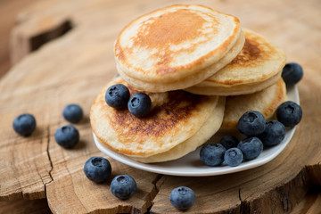 Close-up of fritters with fresh blueberries, horizontal shot