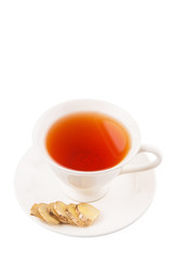 Ginger slices and a cup of tea over white background